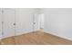 Clean bedroom boasts two entry doors and sleek, modern door handles at 2362 English Ave, Indianapolis, IN 46201