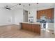 Bright modern kitchen featuring stainless steel appliances, a stylish island, and open layout to living space at 2362 English Ave, Indianapolis, IN 46201