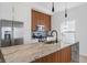Bright kitchen features granite countertops, stainless steel appliances, and modern cabinetry at 2362 English Ave, Indianapolis, IN 46201