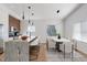Modern kitchen features stainless steel appliances, stylish countertops, and a connected dining area at 2362 English Ave, Indianapolis, IN 46201