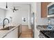 Modern kitchen boasts granite countertops, stainless appliances, and ample cabinet space at 2362 English Ave, Indianapolis, IN 46201