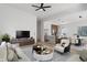 Open-concept living space with modern furnishings and a view into the sleek kitchen and dining area at 2362 English Ave, Indianapolis, IN 46201
