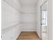 Spacious walk-in closet with wire shelving and wood-look floors at 2362 English Ave, Indianapolis, IN 46201