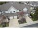 Aerial view of townhouses showcasing the well-maintained exteriors, landscaping, and convenient parking at 256 Strand Ln # Apt C, Avon, IN 46123