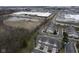 Overhead view showcasing townhomes near a large commercial building and a pond with natural surroundings at 256 Strand Ln # Apt C, Avon, IN 46123