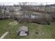 Scenic aerial view featuring a covered picnic area, pond, and residential area with mature trees at 256 Strand Ln # Apt C, Avon, IN 46123