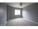 Bright, carpeted bedroom with neutral walls, a ceiling fan, and a window offering natural light, perfect for relaxation at 256 Strand Ln # Apt C, Avon, IN 46123