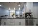 Modern kitchen features a black marble countertop island with white cabinets and stainless steel appliances at 256 Strand Ln # Apt C, Avon, IN 46123