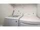 Bright laundry room features white washer and dryer at 256 Strand Ln # Apt C, Avon, IN 46123