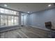 Bright and spacious living area featuring a large window and sleek wood flooring at 256 Strand Ln # Apt C, Avon, IN 46123