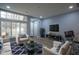 Open floor plan showcasing the living room, front door, and wood-style flooring throughout the home at 256 Strand Ln # Apt C, Avon, IN 46123