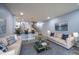 Spacious living room featuring modern furniture, hardwood floors, and contemporary decor at 256 Strand Ln # Apt C, Avon, IN 46123
