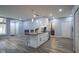 Open-concept living space featuring kitchen bar, dining area, and modern finishes throughout the home at 256 Strand Ln # Apt C, Avon, IN 46123