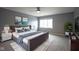Comfortable bedroom with plush grey carpet, modern furniture, and bright window at 256 Strand Ln # Apt C, Avon, IN 46123