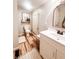 Well-lit bathroom with a modern vanity, decorative mirror, and stylish flooring at 316 Laurel St, Pendleton, IN 46064