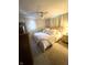 Comfortable bedroom with a ceiling fan, warm lighting, and neutral decor at 316 Laurel St, Pendleton, IN 46064