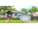 Charming single-story home with a gray exterior, covered porch, and well-maintained landscaping at 316 Laurel St, Pendleton, IN 46064