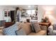 Bright living room with modern decor, stainless steel refrigerator, and open shelving at 316 Laurel St, Pendleton, IN 46064