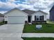 Charming single-story home with a two-car garage and well-manicured lawn at 3181 W Keepsake Ln, Monrovia, IN 46157