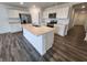 Modern kitchen with a large center island, stainless steel appliances, and white cabinetry at 3181 W Keepsake Ln, Monrovia, IN 46157