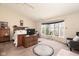 Spacious bedroom with large windows, offering plenty of natural light and a comfortable sitting area, enhancing the room's appeal at 3334 Eden Village Pl, Carmel, IN 46033