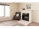 Cozy bedroom showcases a fireplace, comfortable chair, and soft rug, creating a serene and inviting retreat for relaxation at 3334 Eden Village Pl, Carmel, IN 46033