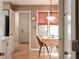 Cozy breakfast nook with a small table and chairs, illuminated by natural light from a nearby window at 3334 Eden Village Pl, Carmel, IN 46033