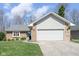 Charming single-Gathering home featuring a two-car garage, brick facade, and well-manicured front lawn at 3334 Eden Village Pl, Carmel, IN 46033