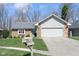 Inviting single-Gathering home with a well-kept lawn, attached garage, and traditional mailbox near the front at 3334 Eden Village Pl, Carmel, IN 46033