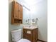 This bathroom features a vanity, mirror, toilet and medicine cabinet at 4429 Tucson Dr, Indianapolis, IN 46241