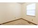 A bright bedroom features a window and neutral carpeting at 4429 Tucson Dr, Indianapolis, IN 46241