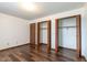Bedroom highlighting closet space, vinyl floors, and natural light at 4429 Tucson Dr, Indianapolis, IN 46241
