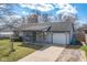 Charming ranch-style home featuring a covered front porch and an attached single-car garage at 4429 Tucson Dr, Indianapolis, IN 46241