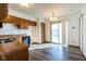 Bright eat-in kitchen featuring wood cabinets, stainless sink, and sliding door to backyard at 4429 Tucson Dr, Indianapolis, IN 46241