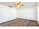 Bright room with wood-look vinyl floors, ceiling fan, and window at 4429 Tucson Dr, Indianapolis, IN 46241