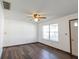 View of living room, showcasing neutral paint, window, and vinyl floor at 4429 Tucson Dr, Indianapolis, IN 46241