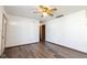 Living room with ceiling fan, wood-look vinyl floors, and neutral paint at 4429 Tucson Dr, Indianapolis, IN 46241