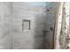 Tiled walk-in shower features built-in niche and rainfall shower head at 4429 Tucson Dr, Indianapolis, IN 46241
