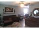 Cozy living room with comfortable seating, ceiling fan, and decoratively adorned walls at 4502 W 36Th St, Indianapolis, IN 46222