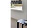 Interior view of a bright, neutral-toned bedroom with large window and minimalist decor at 4712 E Shadowbrook Dr, Camby, IN 46113