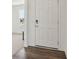 Featuring a welcoming entryway with elegant wood-look flooring and a pristine white door at 4712 E Shadowbrook Dr, Camby, IN 46113