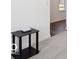 Bright hallway featuring wood-look flooring, leading towards the living space and kitchen at 4712 E Shadowbrook Dr, Camby, IN 46113