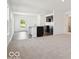 Bright and airy living room with neutral walls, modern flooring and an open floor plan into the kitchen at 4712 E Shadowbrook Dr, Camby, IN 46113