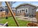 Charming backyard features a fire pit and a cozy seating area, perfect for outdoor entertaining at 5226 E St Clair St, Indianapolis, IN 46219