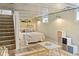 Finished basement with exposed ceiling, carpeted stairs, sleeping area, and play area at 5226 E St Clair St, Indianapolis, IN 46219