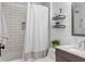 Bright bathroom with white subway tile shower, shiplap accent wall, and modern vanity at 5226 E St Clair St, Indianapolis, IN 46219