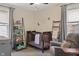Cozy Bedroom with a dark wood crib, charming decorations, and a comfortable glider at 5226 E St Clair St, Indianapolis, IN 46219