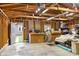 Interior view of an oversized garage featuring exposed wood rafters and ample workspace at 5226 E St Clair St, Indianapolis, IN 46219