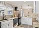 Updated kitchen features granite countertops, modern appliances, and ample cabinet space at 5226 E St Clair St, Indianapolis, IN 46219