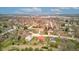 Wide aerial shot displaying a neighborhood with diverse architectural styles, surrounded by nature and city views at 528 Wind Skip Cir, Westfield, IN 46074